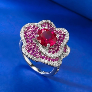 Detail of S925 silver ring with pigeon blood red flower petal and pavé-set zircons