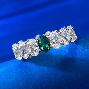 Classic silver ring with 4x6mm oval green gemstone and clear zircon side stones