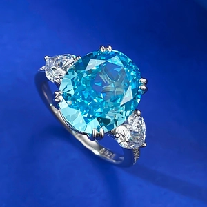 Macro shot of oval sea blue gemstone ring showing S925 silver engraving detail