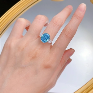 Three-stone S925 silver ring with oval sea blue gemstone and pear-shaped side diamonds