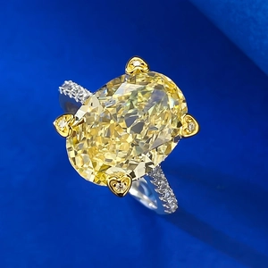 Luxurious S925 silver ring featuring a large oval yellow carbon diamond in heart prongs