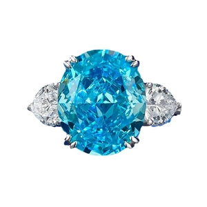 Elegant S925 silver ring featuring a large oval sea blue gemstone and pear side stones