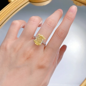 Luxurious S925 silver ring with a large oval yellow carbon diamond on a hand
