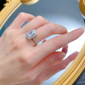 Detail of 925 sterling silver ring with 6x9mm emerald cut stone on a model hand