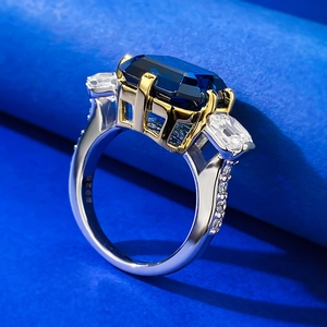 S925 silver ring featuring emerald-cut royal blue sapphire with side trapezoid stones