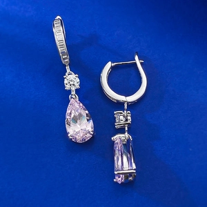 Detailed view of pear-cut pink crystal drop earrings with sparkling zircon accents