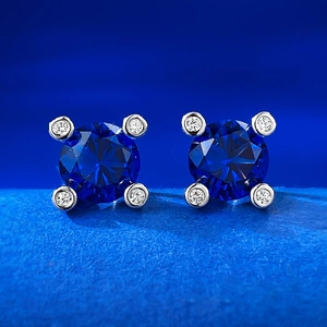 Vintage S925 silver stud earrings featuring 1ct round blue sapphire and halo diamonds