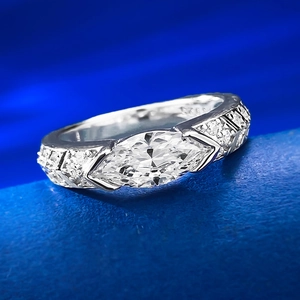 Macro detail of S925 silver ring with marquise cut pink diamond and pavé side stones