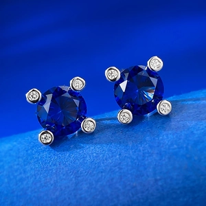 Classic 925 silver stud earrings featuring 1ct round blue sapphire with halo accents
