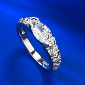 S925 sterling silver ring featuring a marquise cut pink stone on blue silk fabric