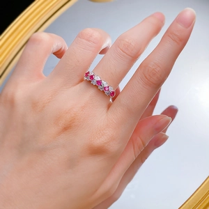 Elegant S925 silver ring featuring marquise red rubies and white gems on a finger