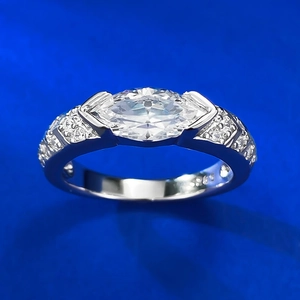 Macro detail of marquise-cut pink stone on S925 sterling silver band with side accents