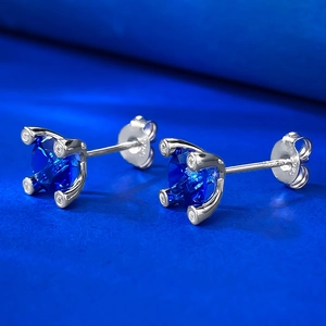Detailed macro shot of S925 sterling silver stamp and blue sapphire stud earring