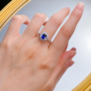Luxurious S925 silver ring featuring an oval blue sapphire surrounded by sparkling diamonds