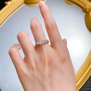 Close-up of S925 silver ring with marquise cut pink stone and pavé setting on hand