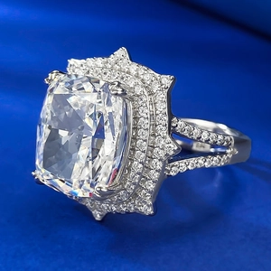 Macro shot of cushion-cut solitaire ring with star-shaped double halo and split shank