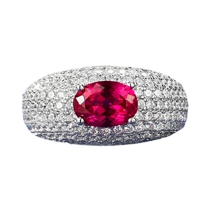 Luxurious wide band ring with large oval ruby and pave-set cubic zirconia accents
