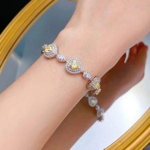 Elegant S925 sterling silver heart-shaped yellow diamond bracelet with paved halo setting