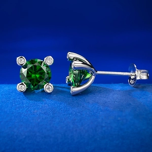Detailed view of S925 sterling silver stamp on vintage green gemstone stud earrings