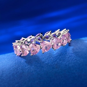 S925 sterling silver heart-shaped eternity ring with pink diamonds on blue background