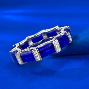 Macro view of S925 silver ring with rectangle blue sapphires and pavé diamonds