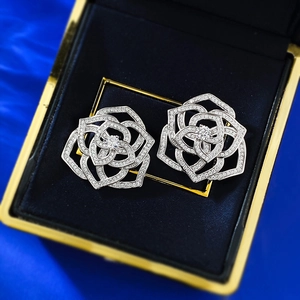 Elegant S925 silver camellia flower stud earrings with shimmering pave-set crystals