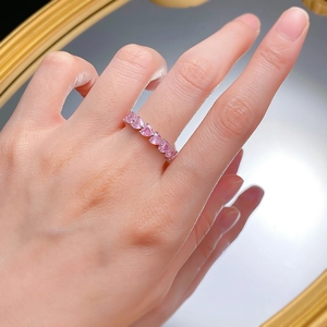 Close-up of S925 silver ring featuring six sparkling pink heart-shaped zircons