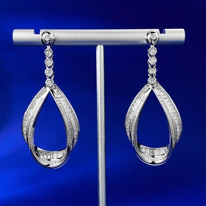 Detailed macro view of S925 silver teardrop earrings featuring 3D twisted pave-set zircon
