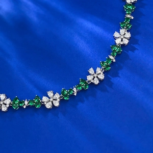 S925 silver floral bracelet featuring white zircon petals and green gemstone leaves