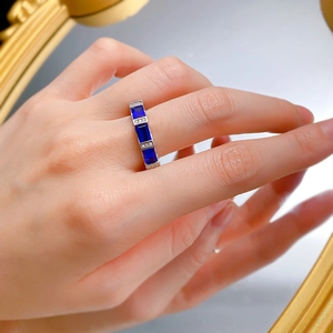 Close-up of S925 silver ring with royal blue rectangular gems and small white diamonds