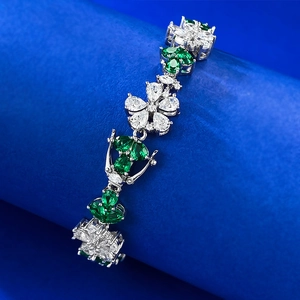 S925 sterling silver floral bracelet with emerald green gems and white crystal petals