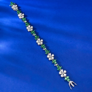 Detail showing S925 silver flower bracelet with emerald and white zircon gemstones