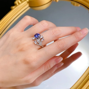 Elegant S925 silver ring with 7x9mm oval tanzanite blue stone and leaf-shaped diamonds