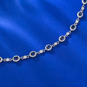 Close-up of S925 silver bracelet featuring oval blue sapphires and white diamond pavé