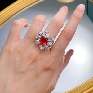 Luxurious S925 silver ring with oval ruby and zircon flower halo on a model with mirror reflex