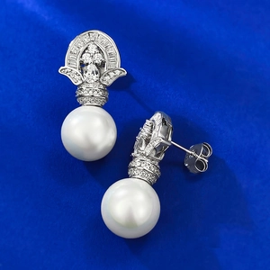 Elegant 925 silver pearl drop earrings with sparkling zircon accents on blue silk