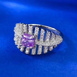 Macro detail of square purple zircon ring with feather-like micro-pave silver setting