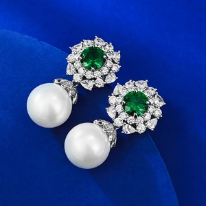 Elegant 925 silver stud earrings with large white pearls and emerald green gemstones
