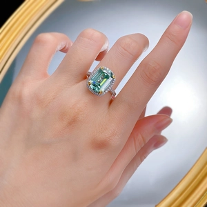 Elegant S925 silver ring with rectangular emerald cut green gemstone and halo diamonds