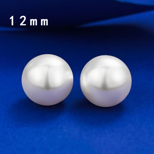 Macro detail of high luster 12mm round white pearls for elegant S925 sterling silver earrings