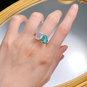 Toi et Moi ring with cushion and pear-cut synthetic Paraiba stones on silver band