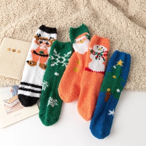 Detailed view of 5-pack Christmas coral fleece socks with festive holiday patterns