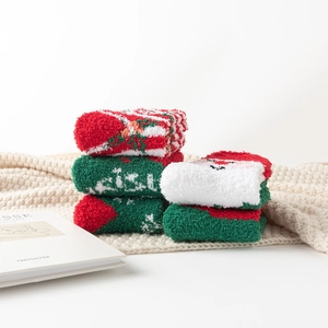 Plush Christmas coral fleece socks set featuring Santa and snowflake patterns in red and green