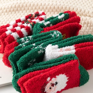 Thick coral fleece Christmas socks featuring festive Santa Claus patterns for winter warmth