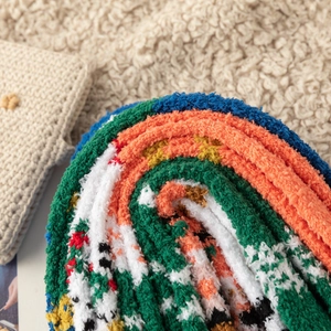 Close-up of soft colorful coral fleece winter socks showing plush texture and warm material