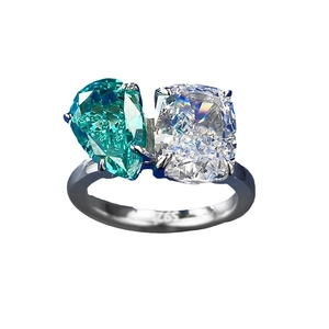 S925 sterling silver ring with pear-cut Paraiba gemstone and cushion-cut cubic zirconia