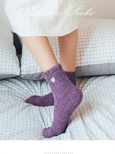 Soft purple coral fleece socks with yellow heart embroidery for cozy winter warmth