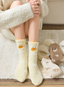 Detailed texture of thick coral fleece socks with cute 3D cartoon duck and bear embroidery