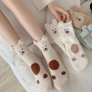 Detailed texture of thick coral fleece socks with cute 3D bear ears and embroidery