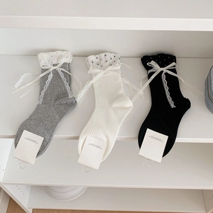 Women's ruffled bow socks in grey, beige, and black with polka dot trim and lace ribbons